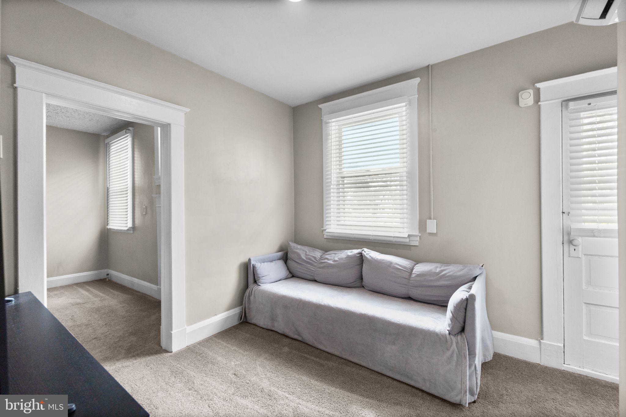 4213 Springdale Avenue Baltimore, MD 21207 - Photo 21 of 41 a living room with furniture and a window