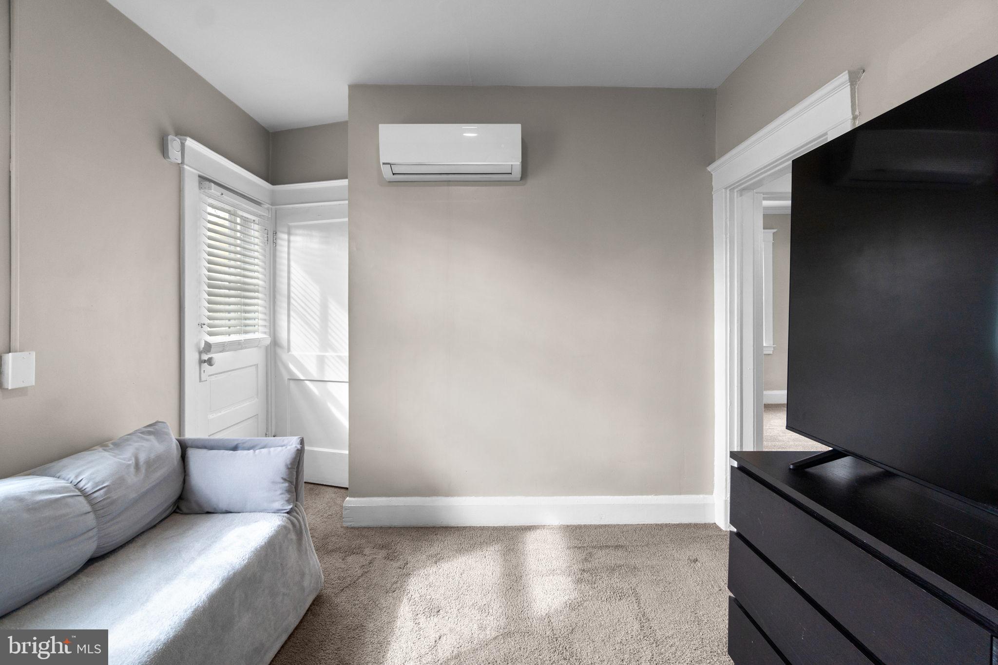 4213 Springdale Avenue Baltimore, MD 21207 - Photo 22 of 41 a living room with furniture and a window