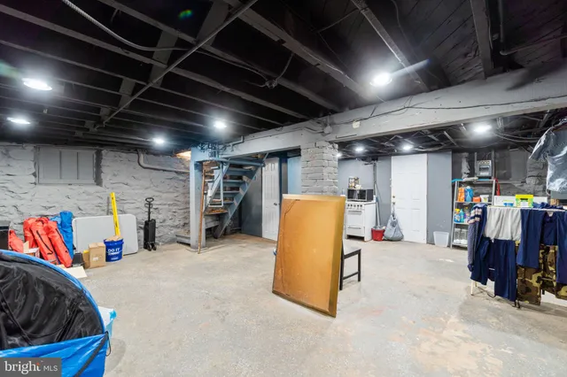 a view of storage and utility room with refrigerator