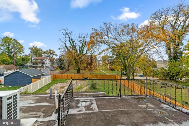 a view of swimming pool with a patio and a yard