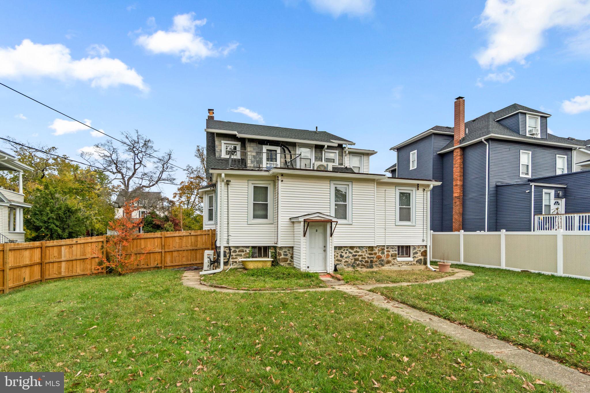 4213 Springdale Avenue Baltimore, MD 21207 - Photo 40 of 41 a view of a house with a yard