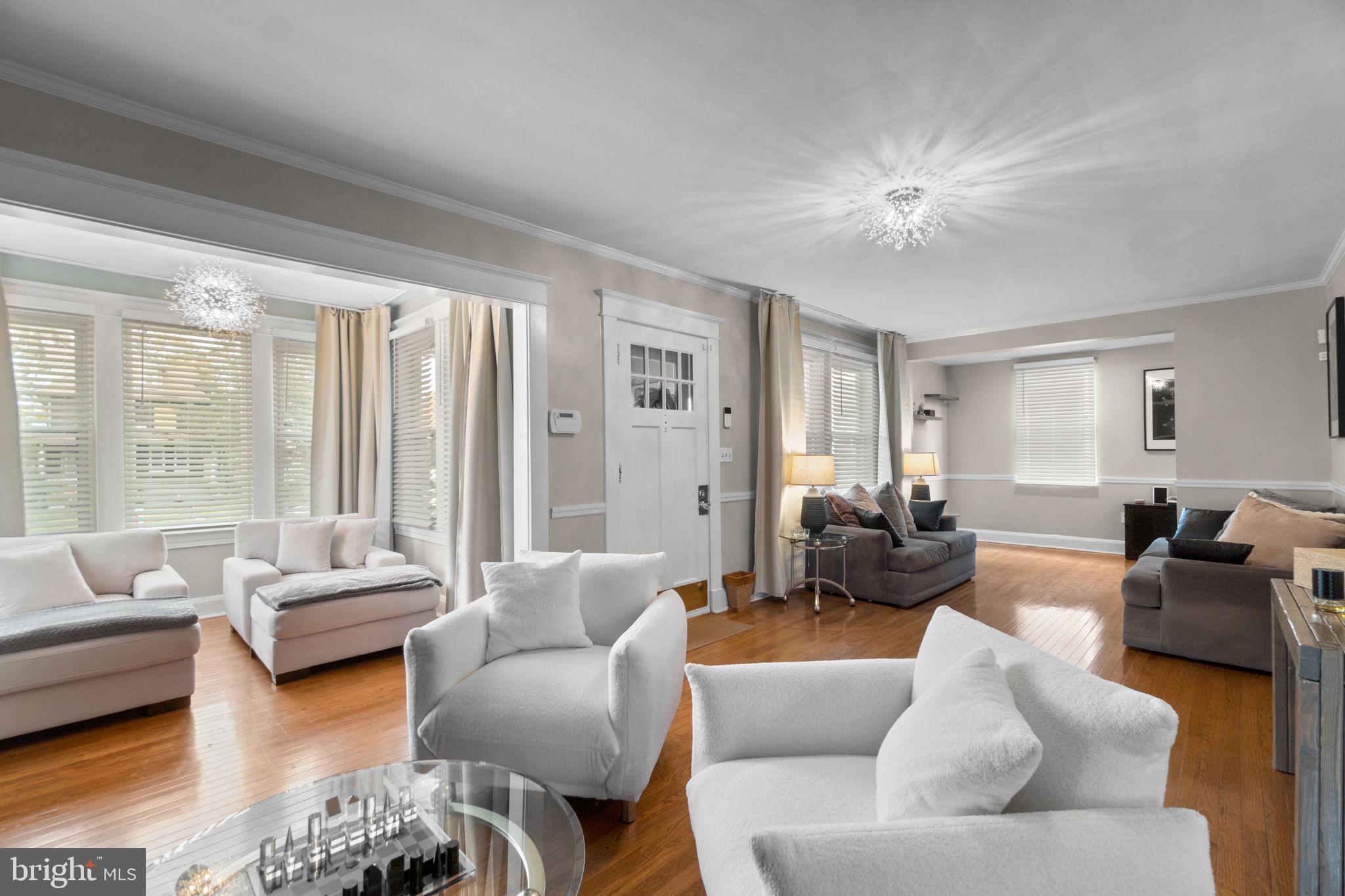 4213 Springdale Avenue Baltimore, MD 21207 - Photo 8 of 41 a living room with furniture and a large window