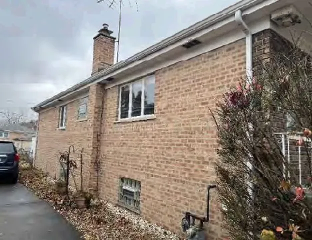 a brick building with a street