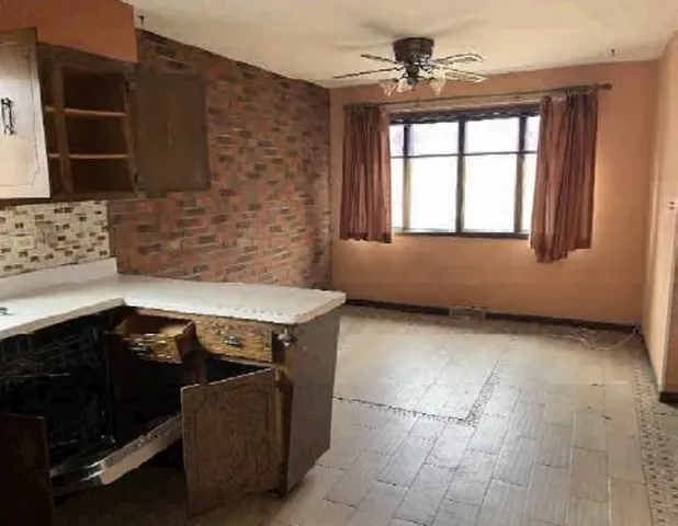 a view of a livingroom with furniture and window