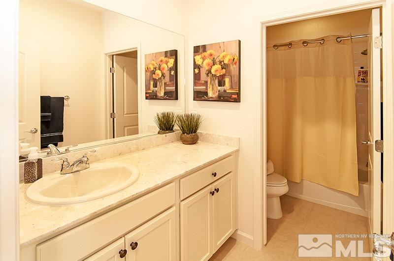 3025 Show Jumper Lane Reno, NV 89521 - Photo 17 of 21 a bathroom with a sink and a mirror