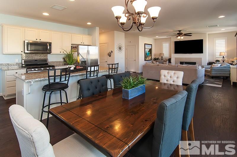 3025 Show Jumper Lane Reno, NV 89521 - Photo 8 of 21 a living room with fireplace furniture and a flat screen tv