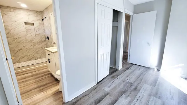 a view of a bathroom from a hallway