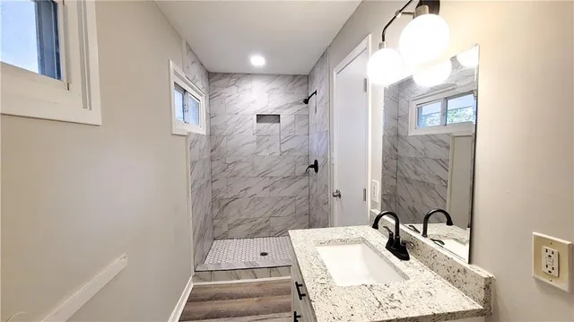 a bathroom with a sink and a mirror
