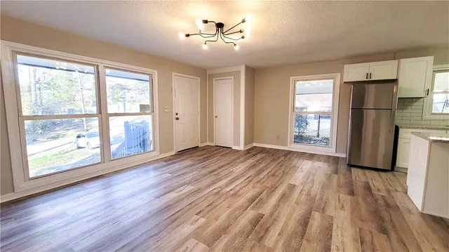 a view of livingroom with hardwood floor and a ceiling fan
