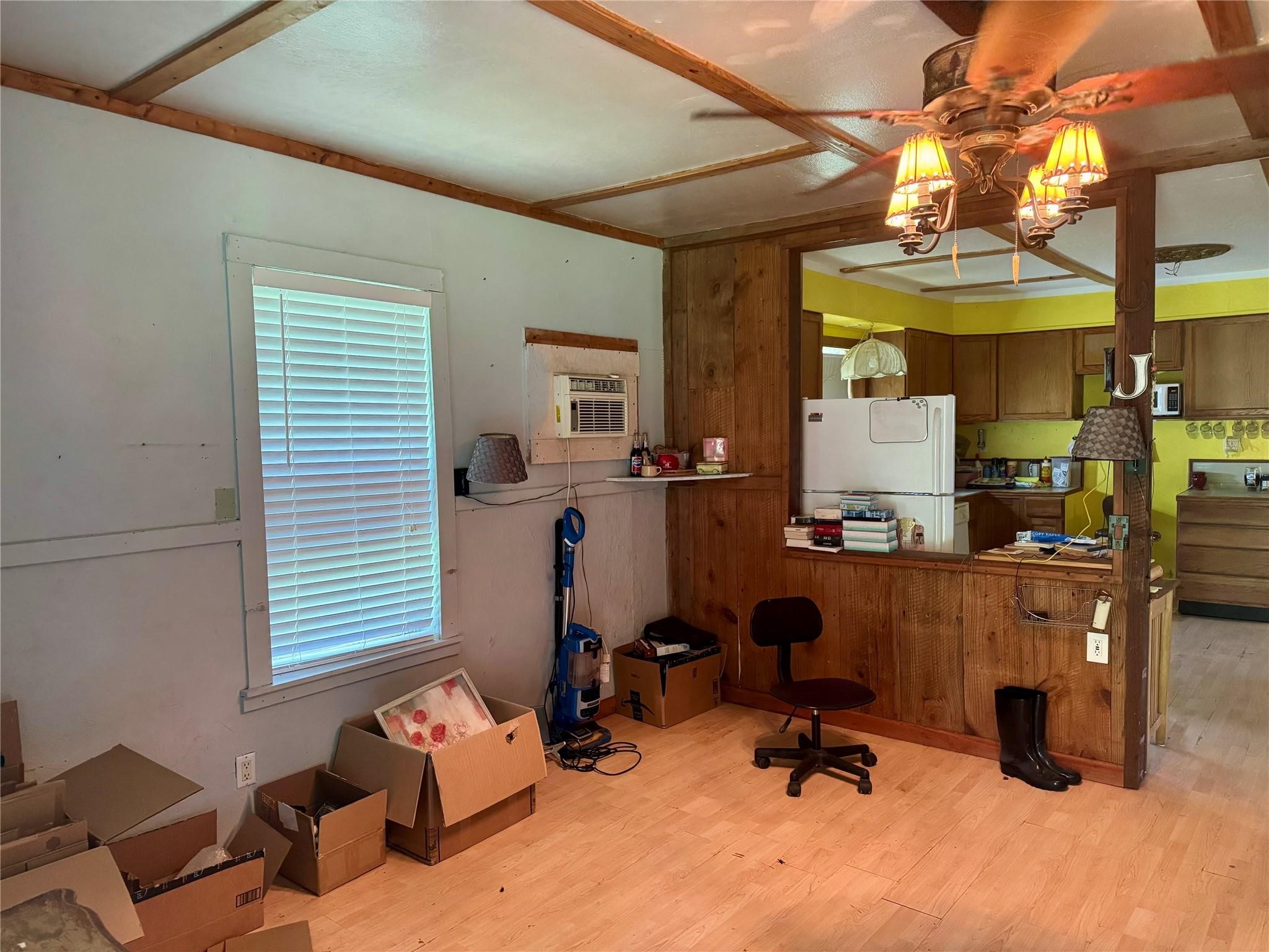 385 Ole Long Pull Road Livingston, TX 77351 - Photo 2 of 12 a view of a workspace with furniture and a window