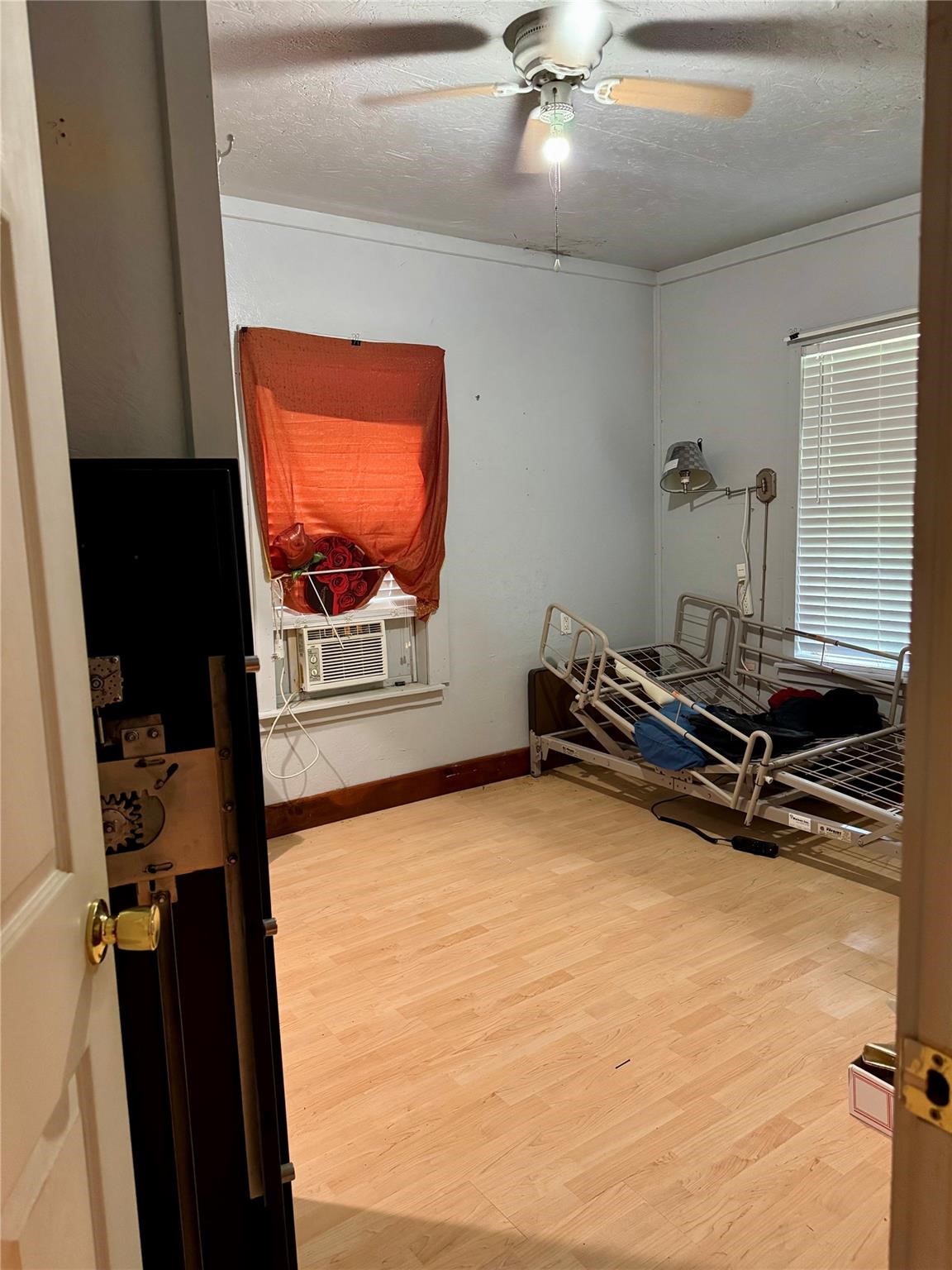 385 Ole Long Pull Road Livingston, TX 77351 - Photo 6 of 12 a room with gym equipment and a flat screen tv