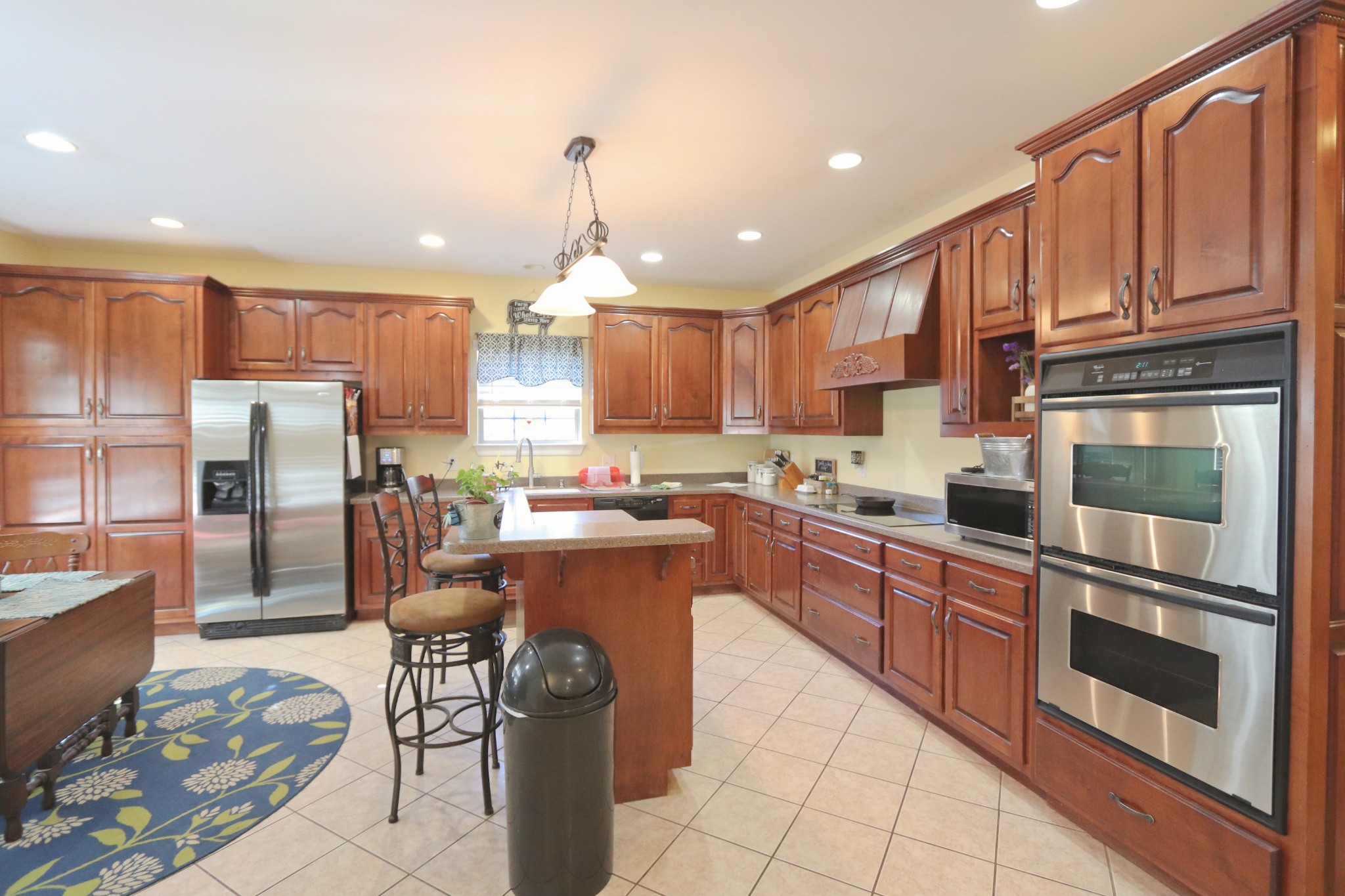 621 Hamilton Chambers Road Lebanon, TN 37087 - Photo 11 of 37 a kitchen with stainless steel appliances granite countertop a refrigerator sink and cabinets