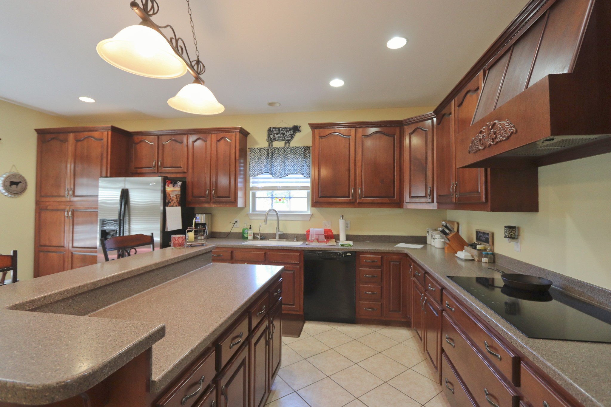 621 Hamilton Chambers Road Lebanon, TN 37087 - Photo 12 of 37 a kitchen with stainless steel appliances granite countertop a sink a stove and a refrigerator
