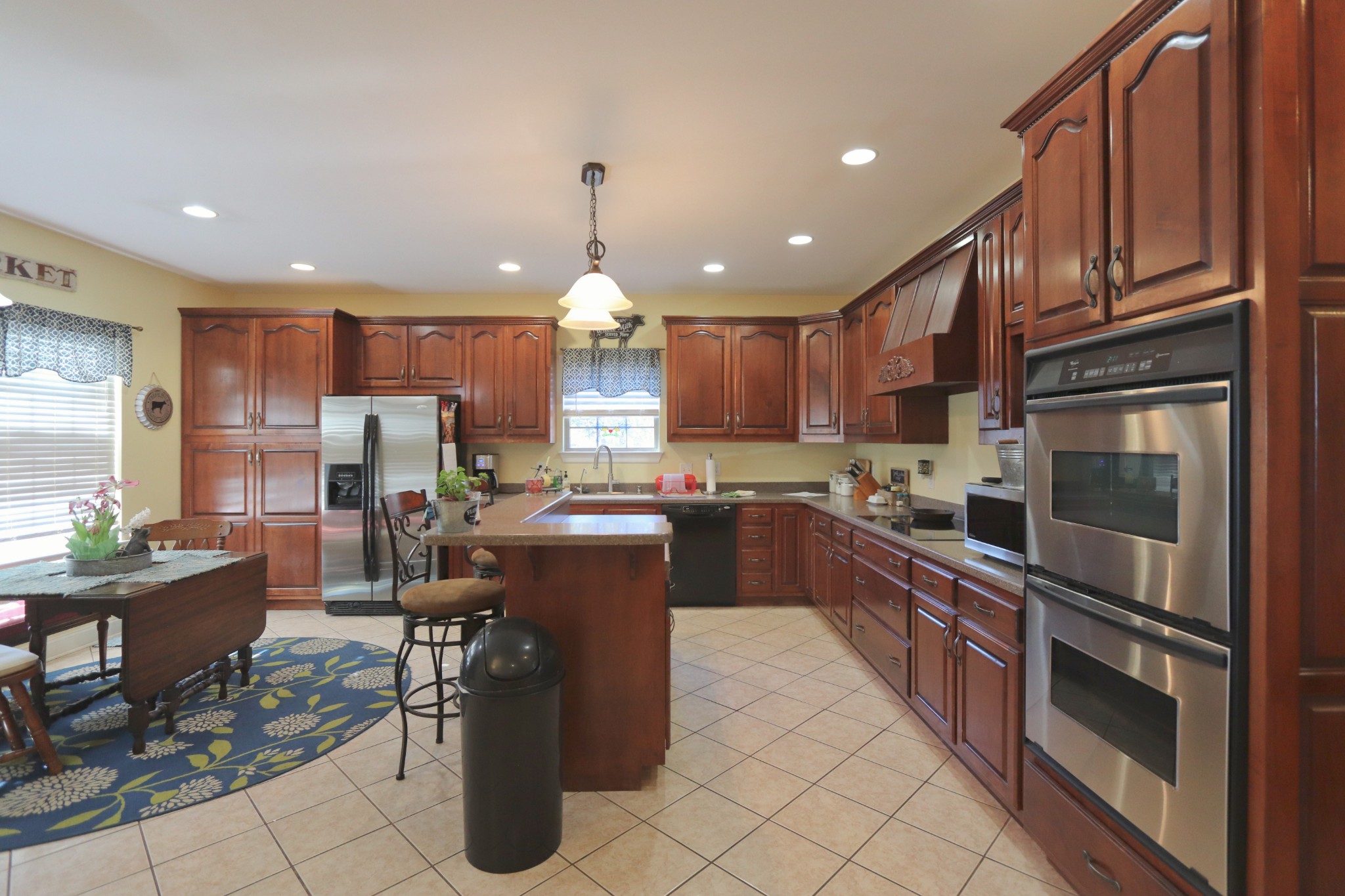 621 Hamilton Chambers Road Lebanon, TN 37087 - Photo 10 of 37 a kitchen with stainless steel appliances granite countertop a refrigerator stove a sink and a microwave