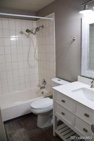 1225 South Oneida Street, Unit 252 Denver, CO 80224 - Photo 9 of 20 a bathroom with a sink toilet and shower