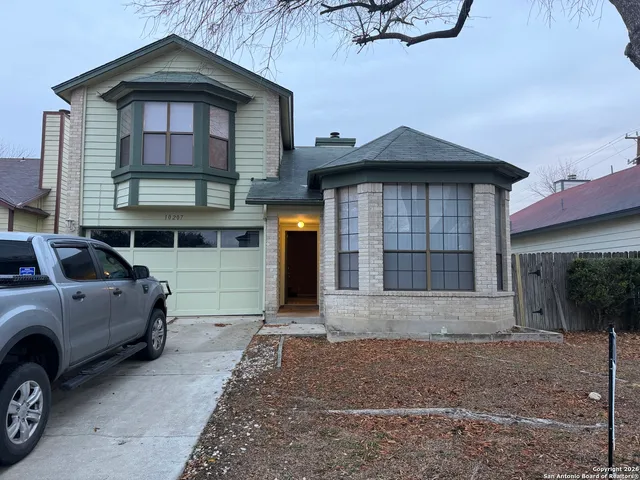 a view of a car in front of house