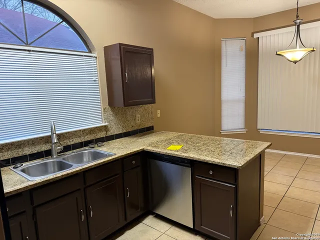 a kitchen with a sink and a cabinets