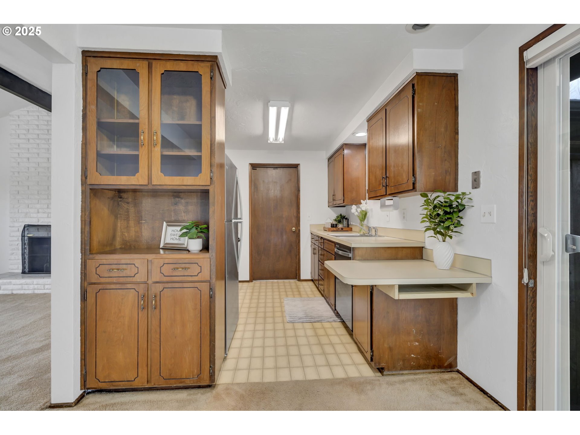 2480 Chuckanut Street Eugene, OR 97408 - Photo 12 of 44 a kitchen with stainless steel appliances kitchen island granite countertop a refrigerator and cabinets