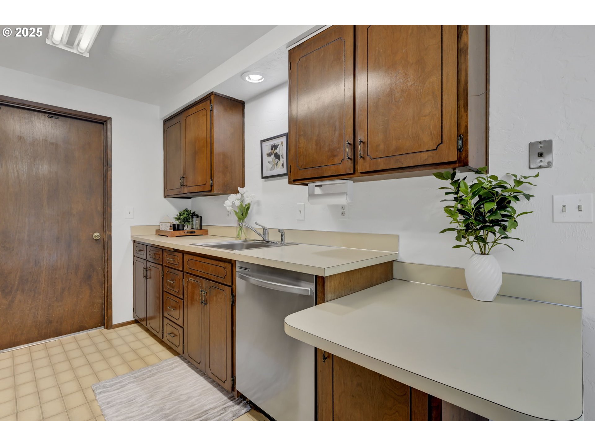 2480 Chuckanut Street Eugene, OR 97408 - Photo 13 of 44 a room with granite countertop a sink a potted plant and a large mirror