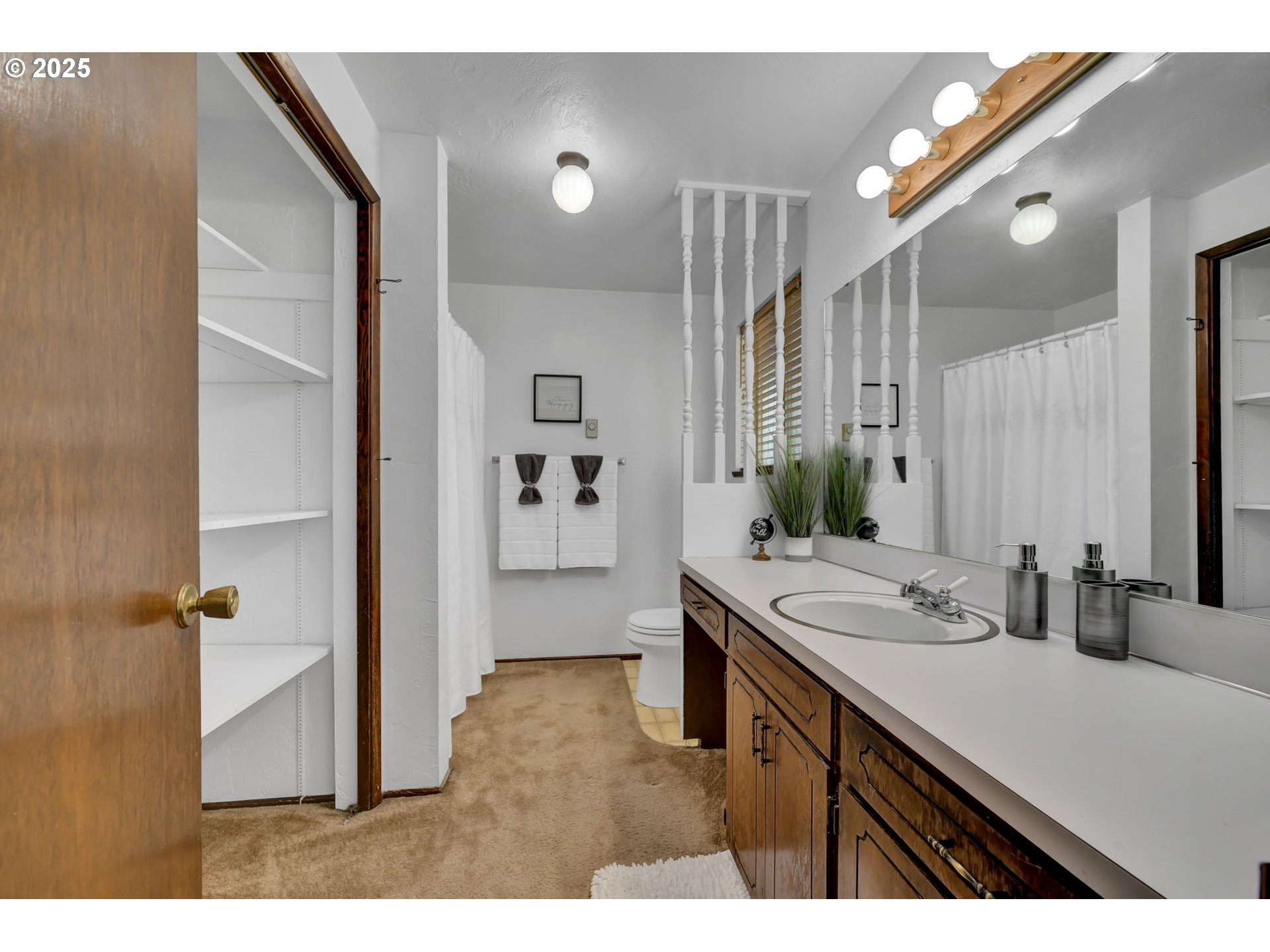 2480 Chuckanut Street Eugene, OR 97408 - Photo 25 of 44 a bathroom with a sink a mirror and a shower