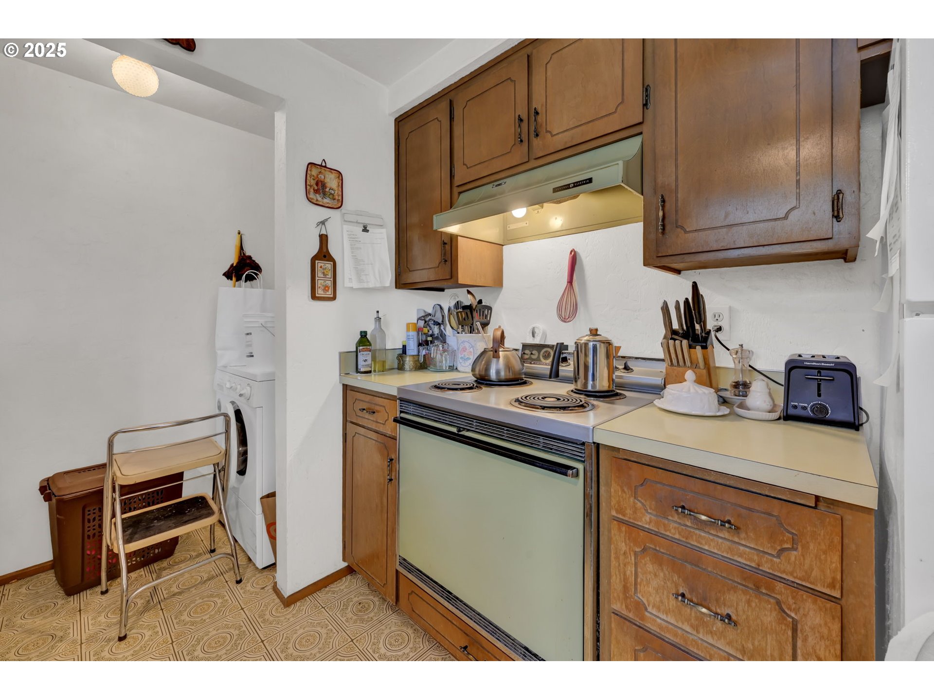 2480 Chuckanut Street Eugene, OR 97408 - Photo 31 of 44 a kitchen with stainless steel appliances granite countertop a sink stove and cabinets
