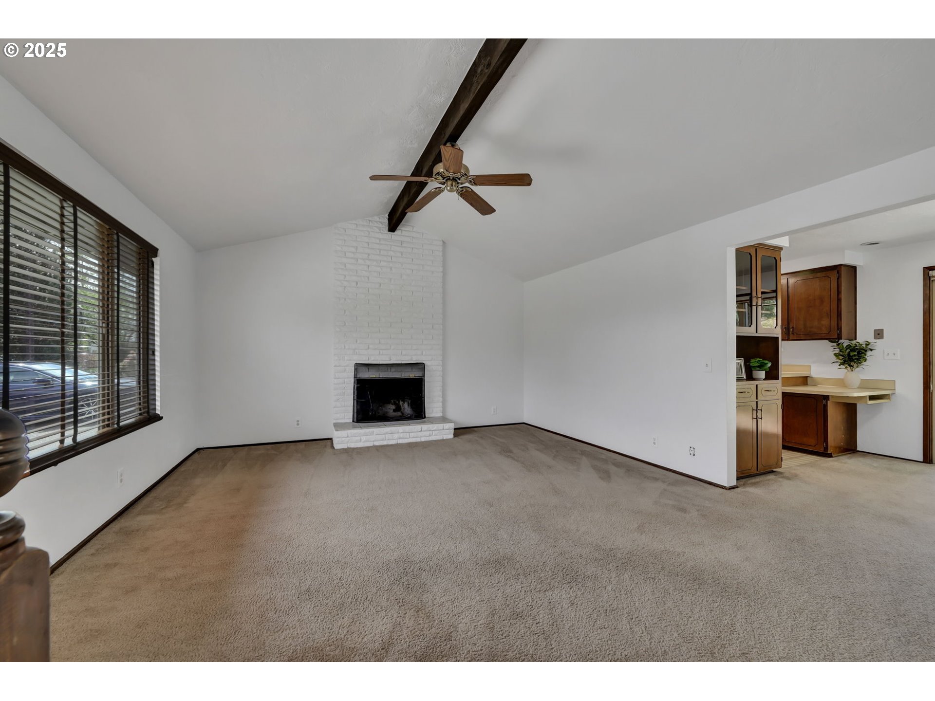 2480 Chuckanut Street Eugene, OR 97408 - Photo 5 of 44 a view of empty room with fireplace and window