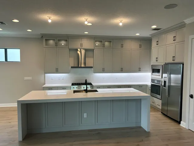 a view of swimming pool with outdoor seating and palm tree