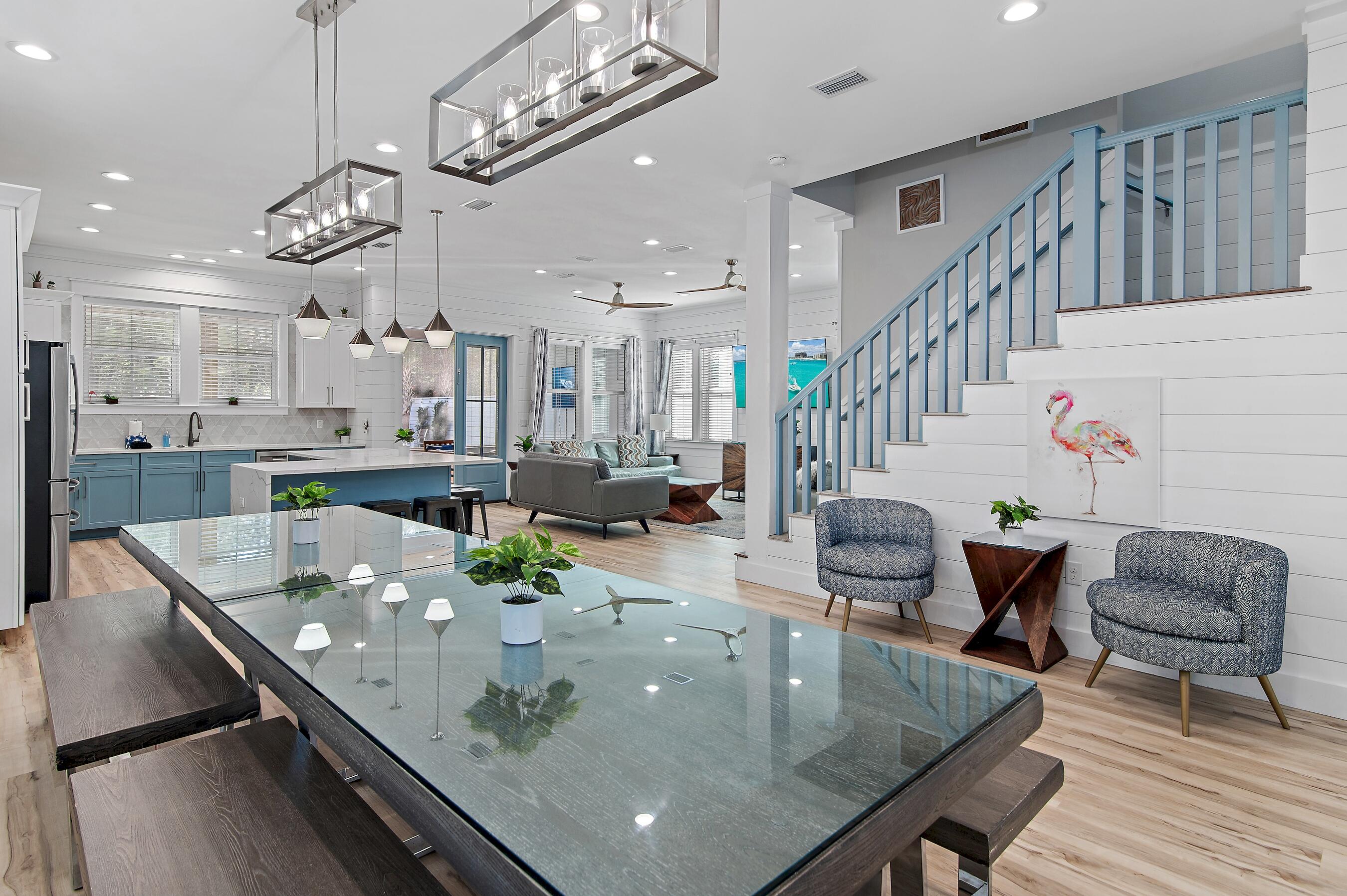 57 Penelope Street Miramar Beach, FL 32550 - Photo 24 of 62 a living room with kitchen island furniture and a chandelier