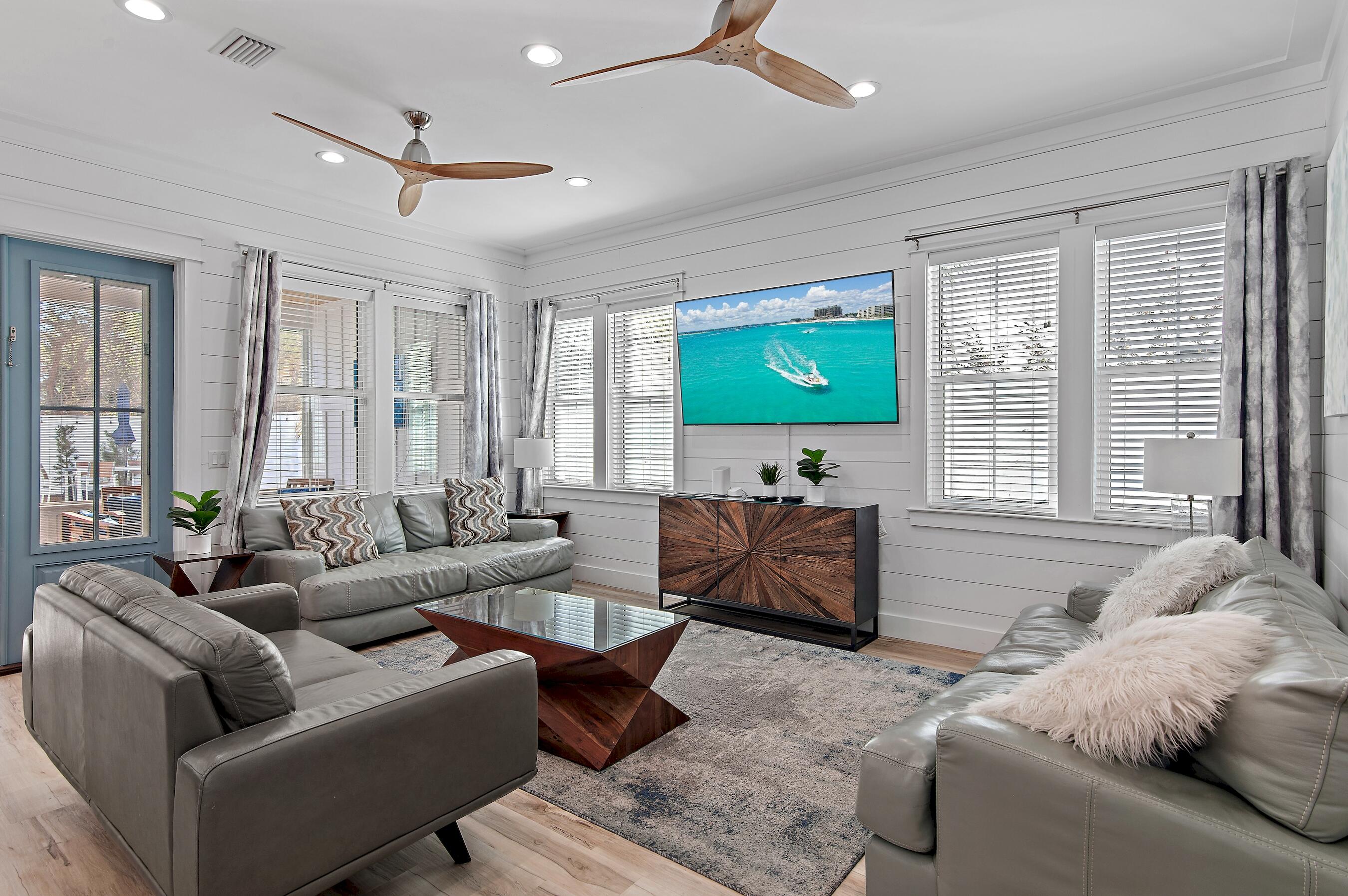 57 Penelope Street Miramar Beach, FL 32550 - Photo 28 of 62 a living room with furniture flat screen tv and a large window