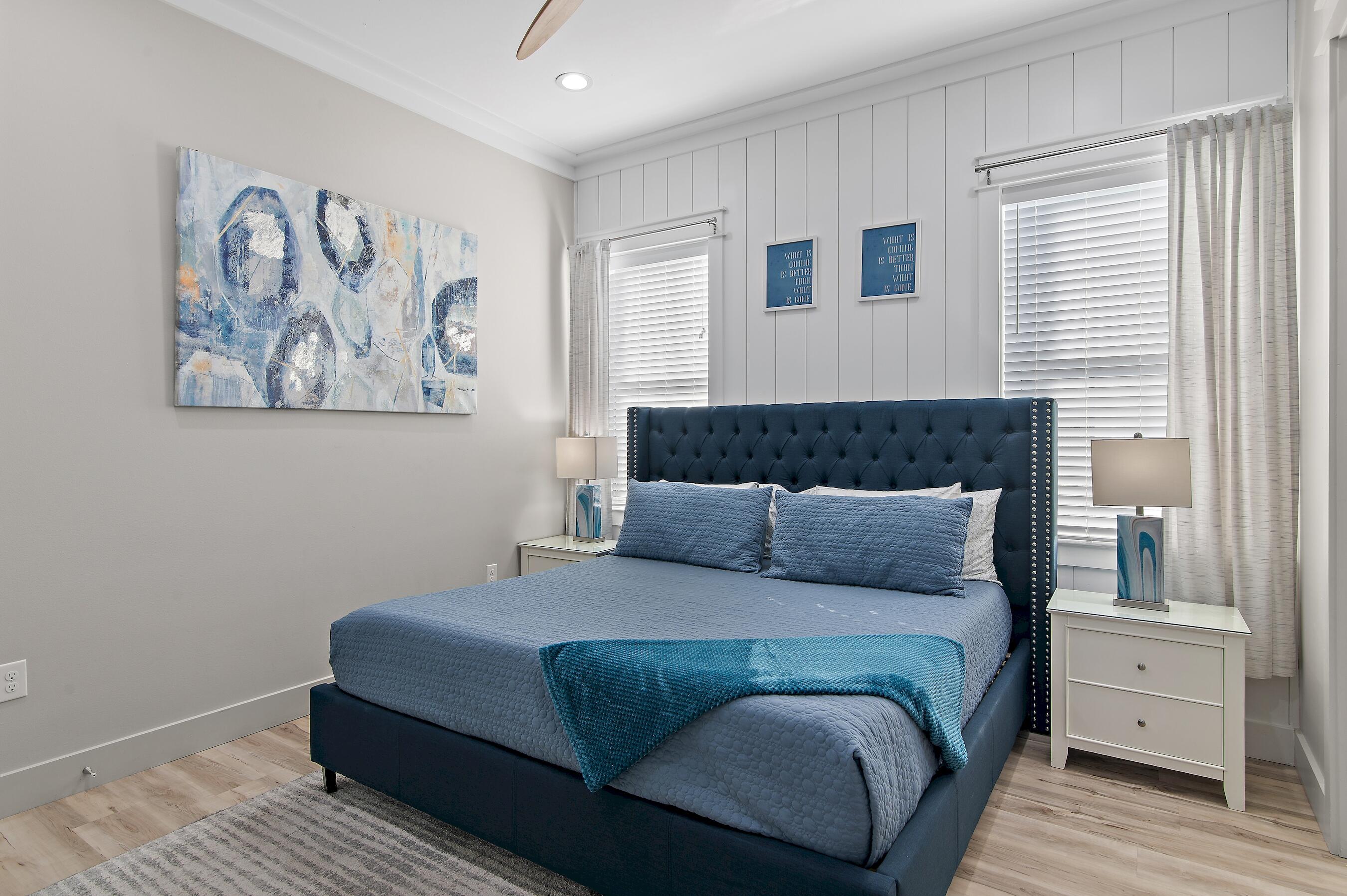 57 Penelope Street Miramar Beach, FL 32550 - Photo 36 of 62 a bedroom with a bed and a painting on the wall