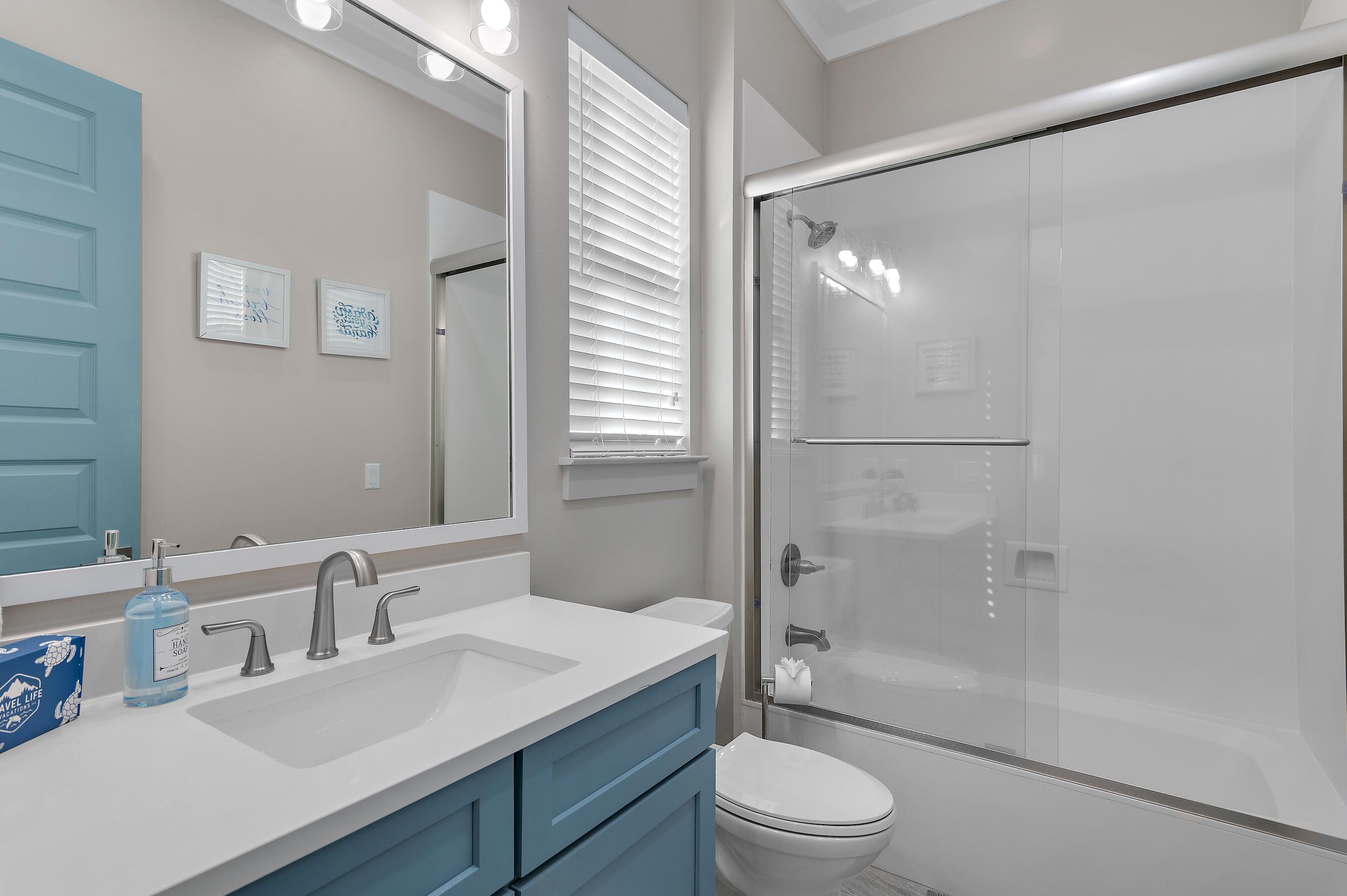 57 Penelope Street Miramar Beach, FL 32550 - Photo 38 of 62 a bathroom with a sink a toilet and shower