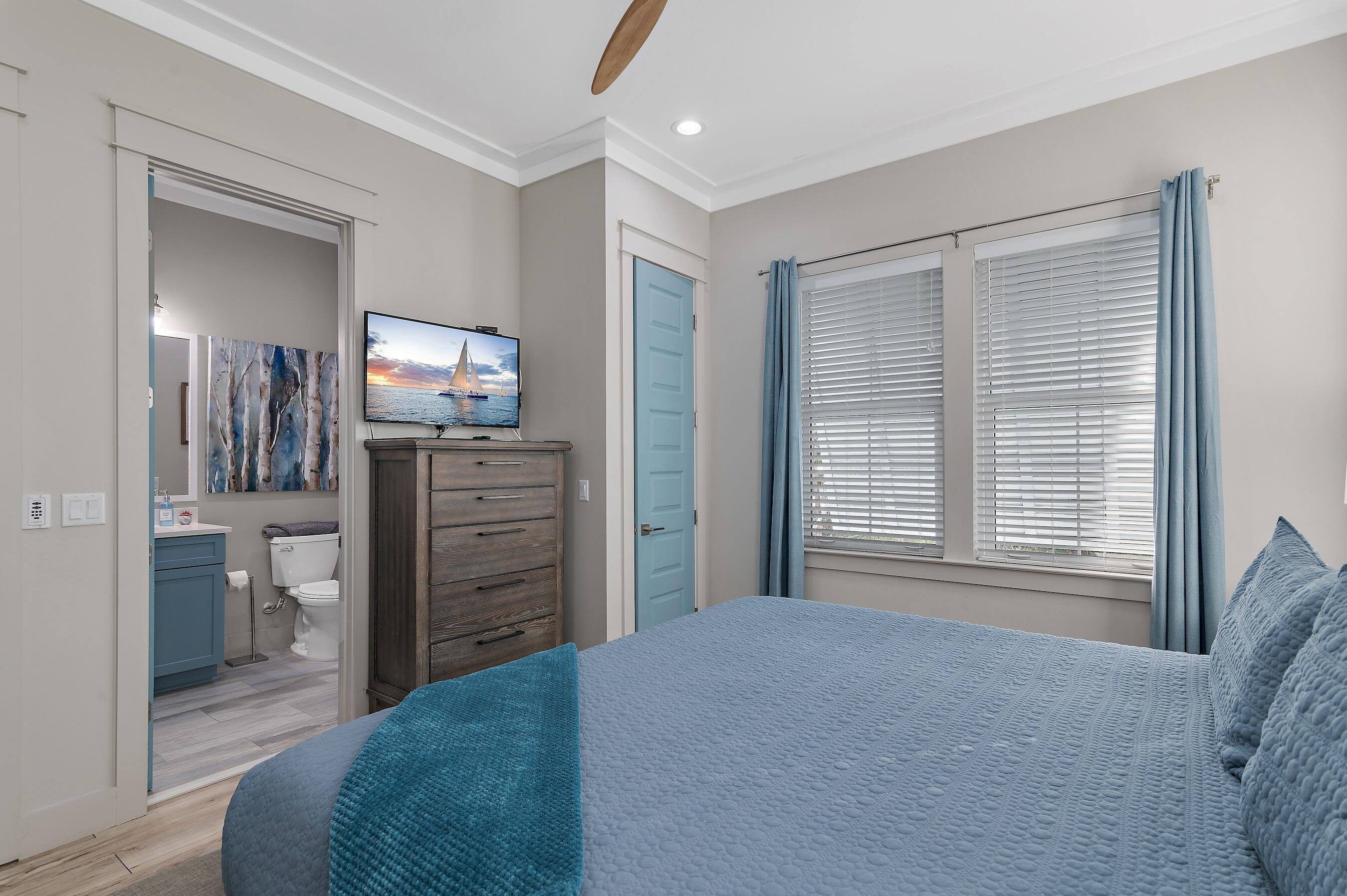 57 Penelope Street Miramar Beach, FL 32550 - Photo 40 of 62 a bedroom with a bed and furniture