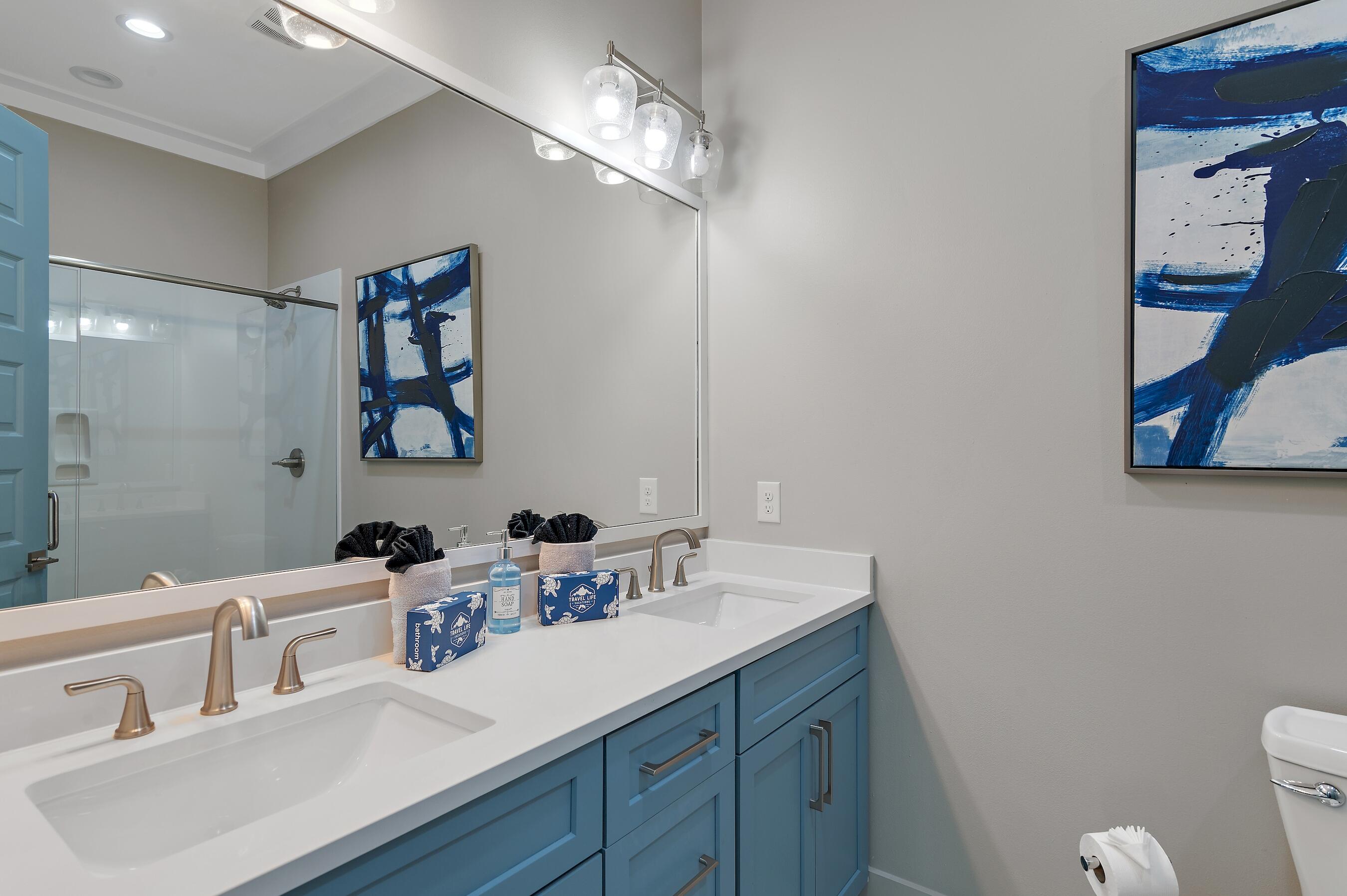 57 Penelope Street Miramar Beach, FL 32550 - Photo 45 of 62 a bathroom with a sink double vanity and a mirror