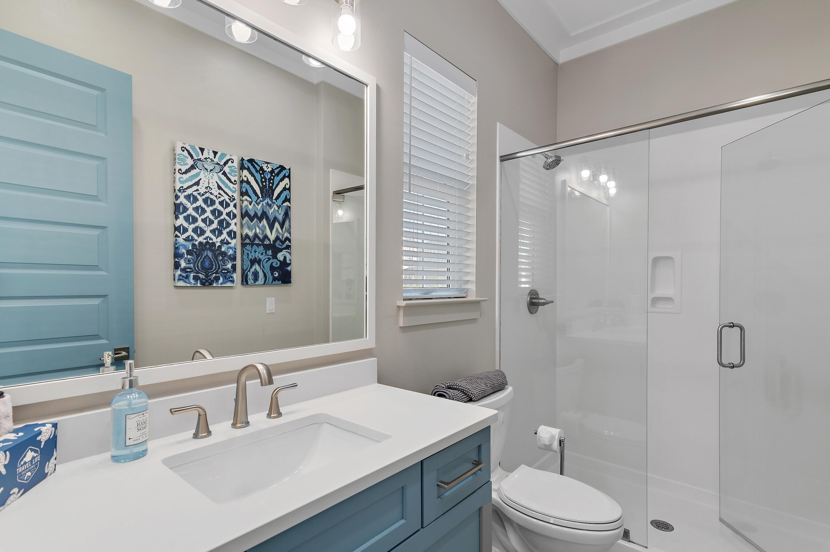 57 Penelope Street Miramar Beach, FL 32550 - Photo 48 of 62 a bathroom with a sink a toilet and shower