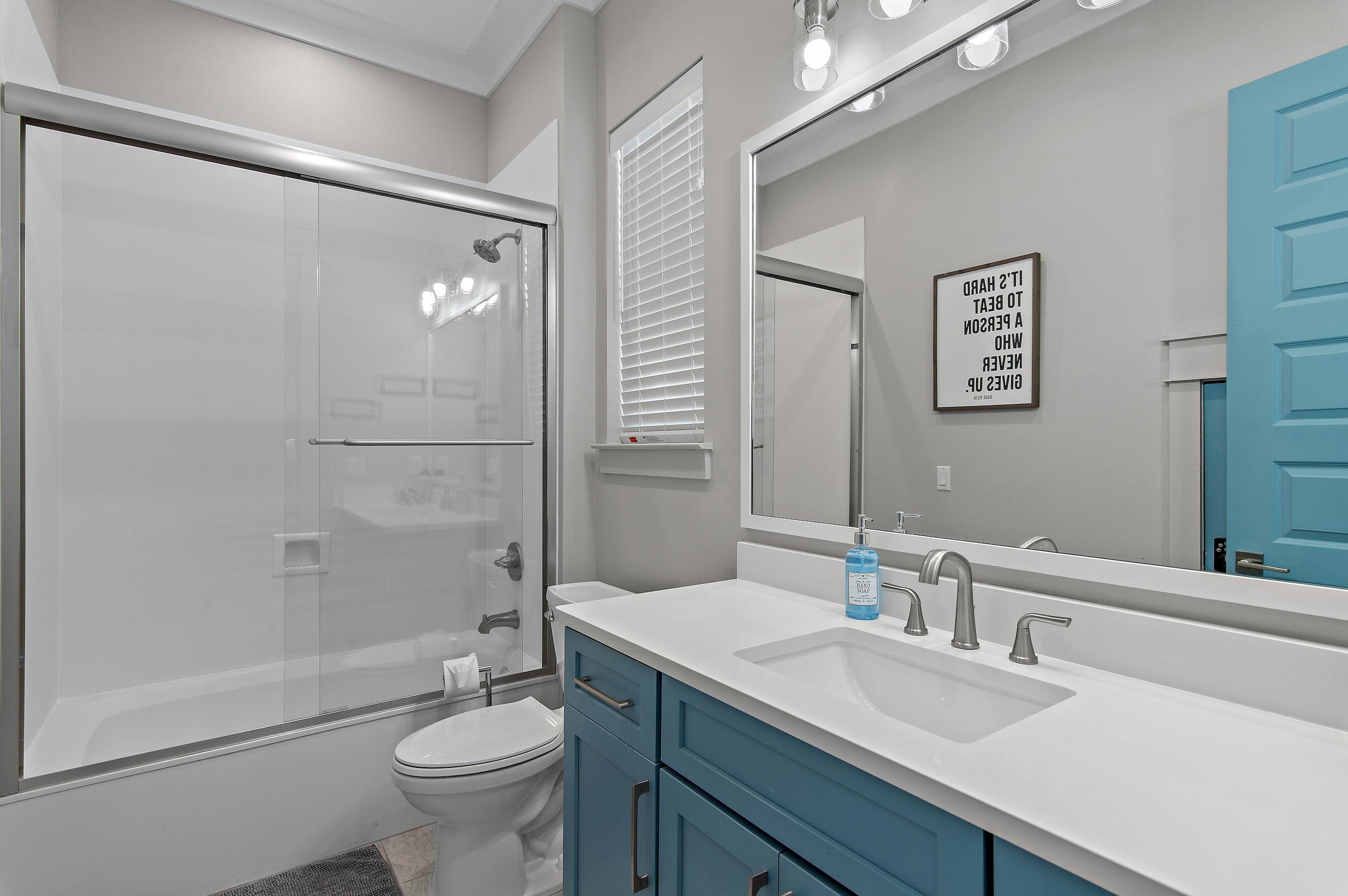 57 Penelope Street Miramar Beach, FL 32550 - Photo 56 of 62 a bathroom with a granite countertop sink toilet and shower