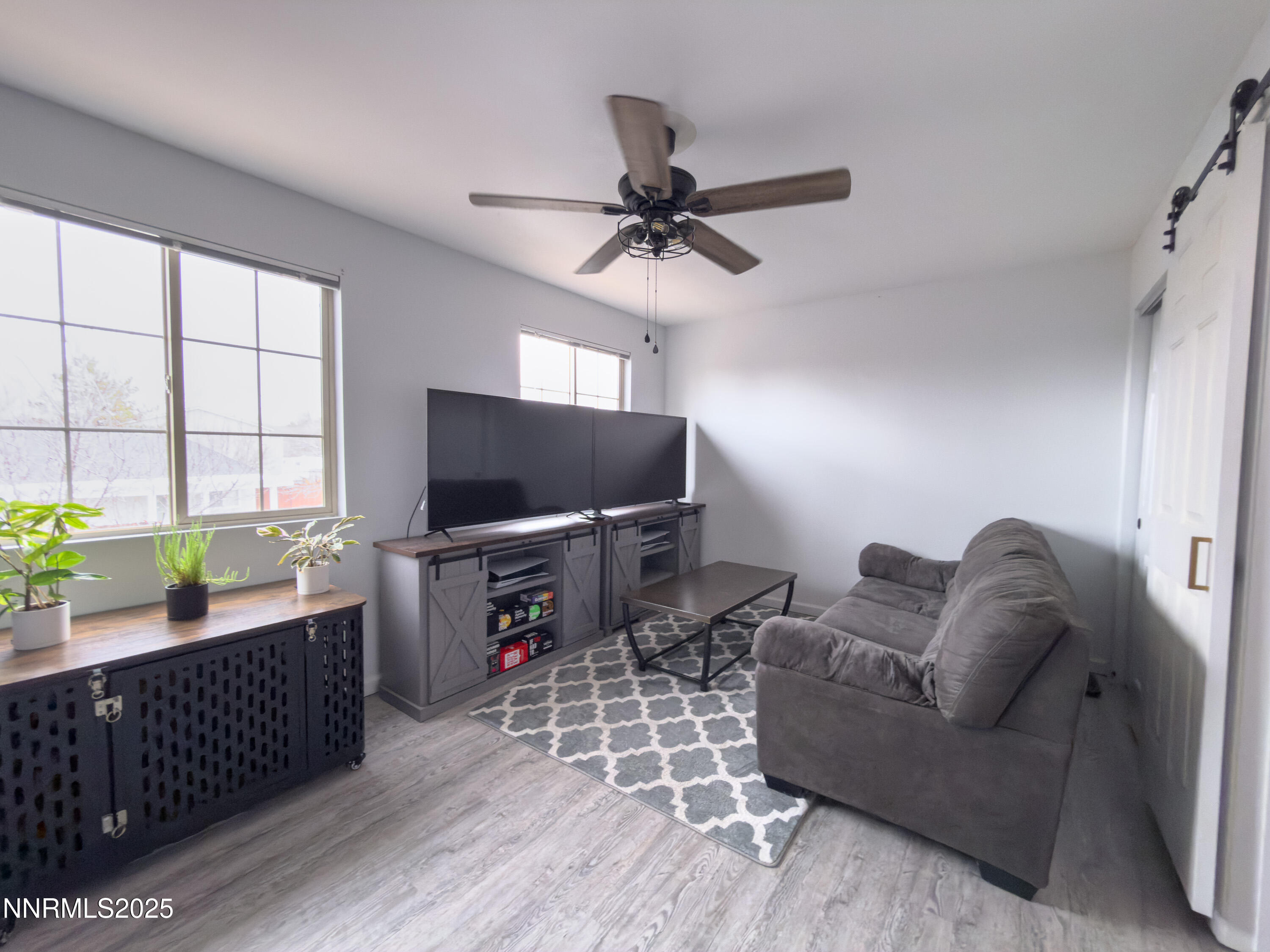 9635 Meadowstar Drive Reno, NV 89506 - Photo 14 of 26 a living room with furniture and a flat screen tv