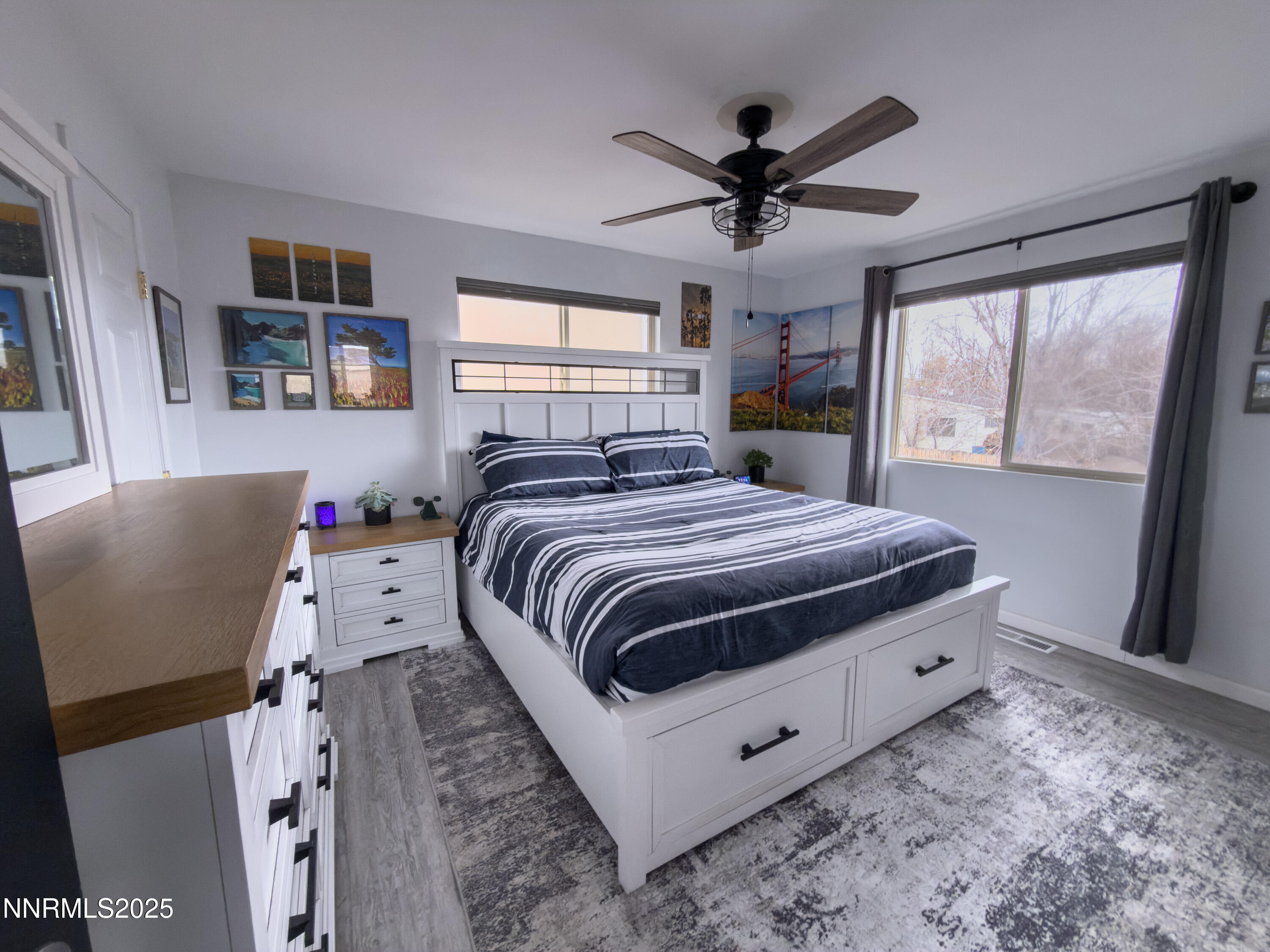 9635 Meadowstar Drive Reno, NV 89506 - Photo 17 of 26 a bedroom with a large bed and a window