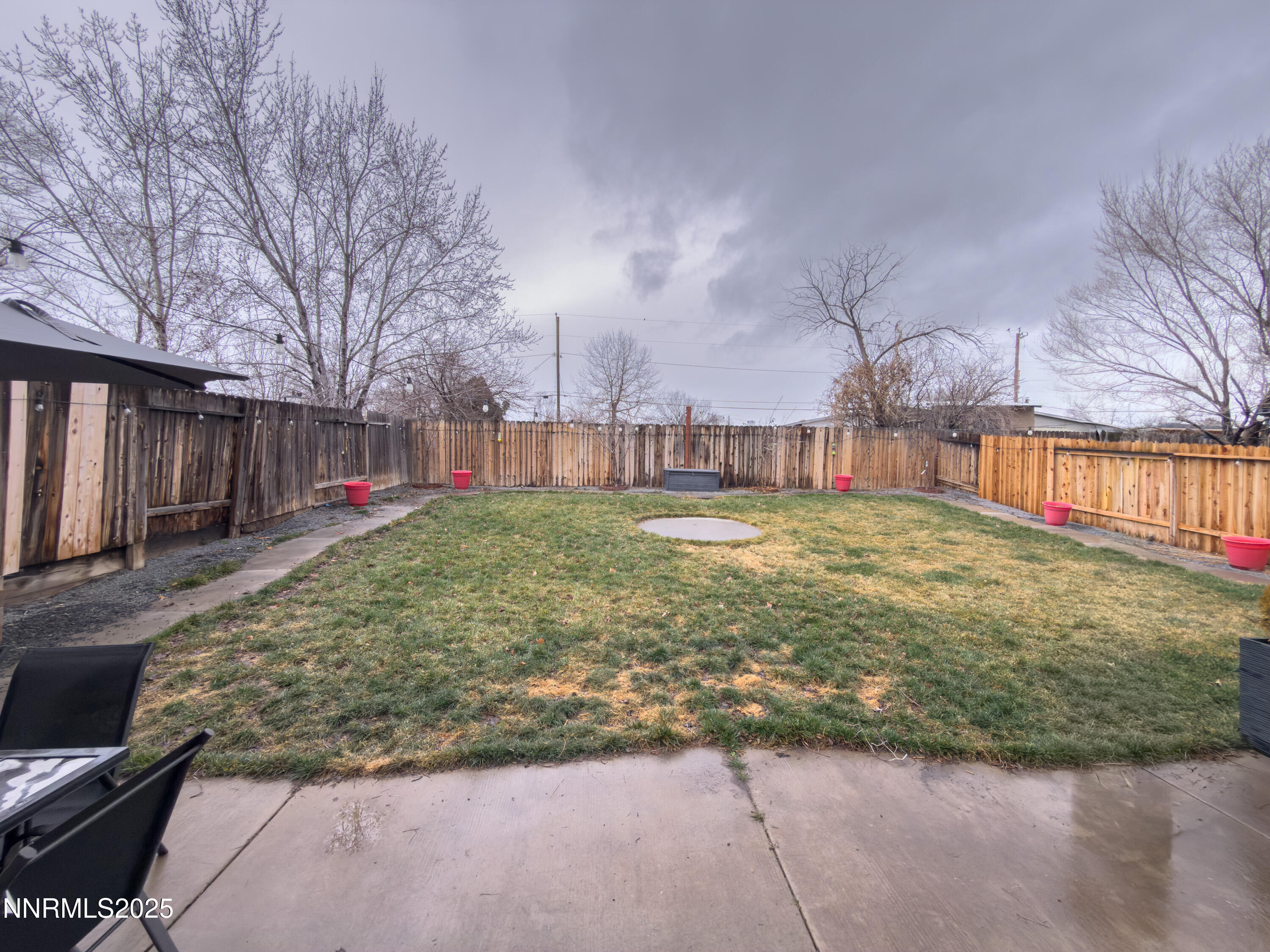 9635 Meadowstar Drive Reno, NV 89506 - Photo 22 of 26 a view of a yard with table and chairs and wooden fence