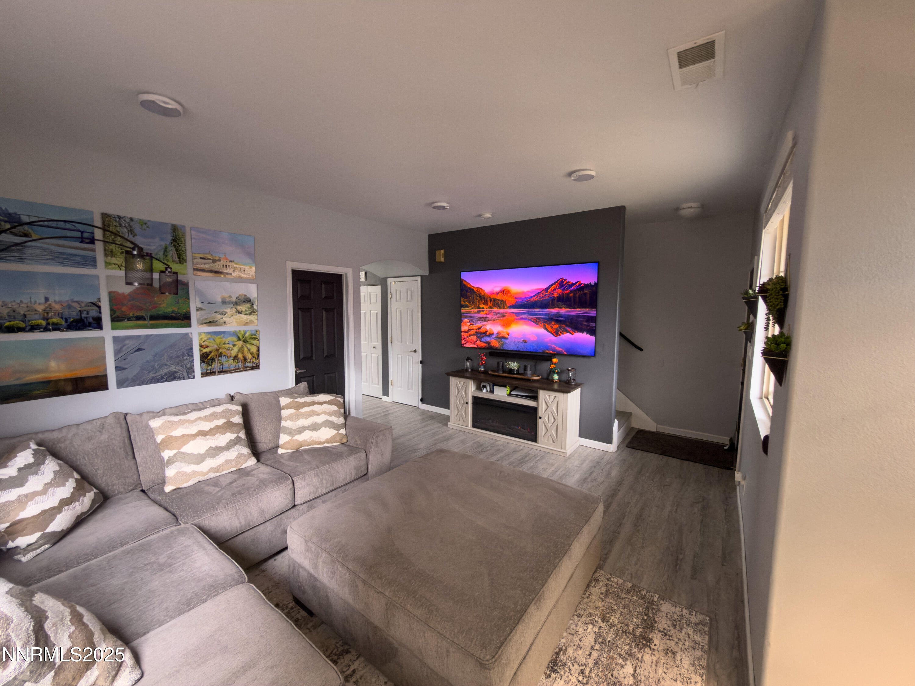 9635 Meadowstar Drive Reno, NV 89506 - Photo 5 of 26 a living room with furniture and a flat screen tv