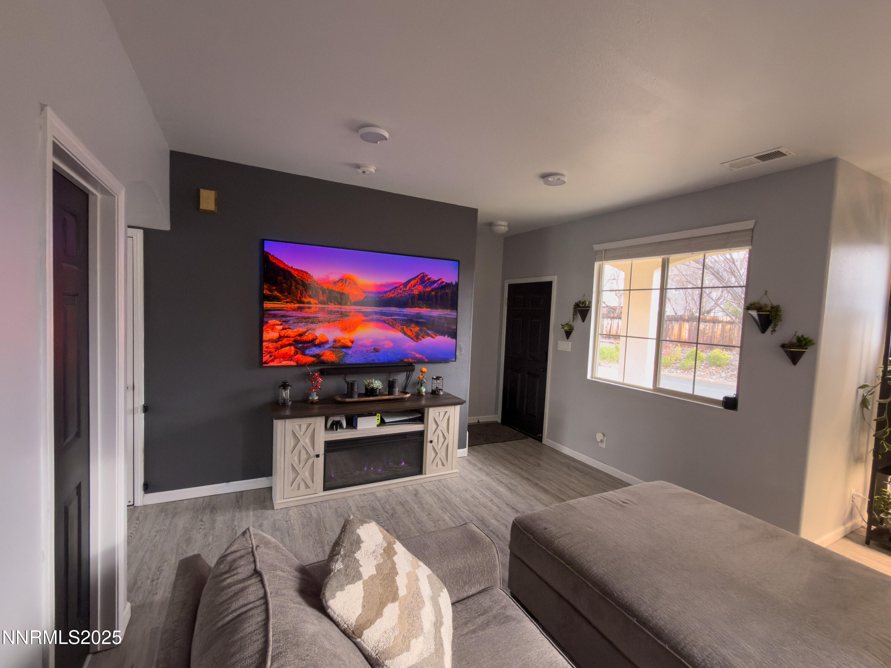 9635 Meadowstar Drive Reno, NV 89506 - Photo 6 of 26 a living room with furniture and a flat screen tv