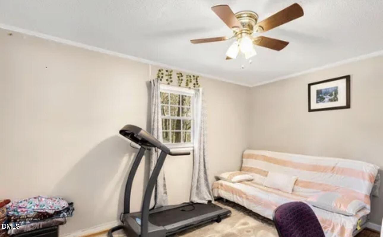810 Milton Road Durham, NC 27712 - Photo 10 of 21 a living room with furniture and a ceiling fan