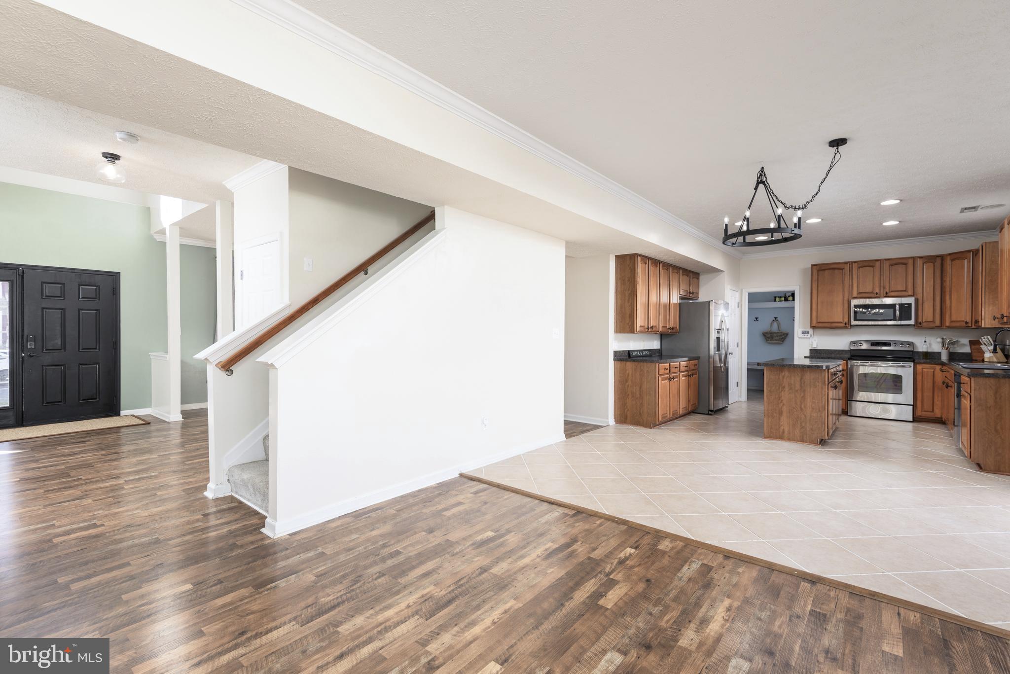 1208 Painted Fern Road Denton, MD 21629 - Photo 11 of 39 a view of a kitchen with furniture and stainless steel appliances