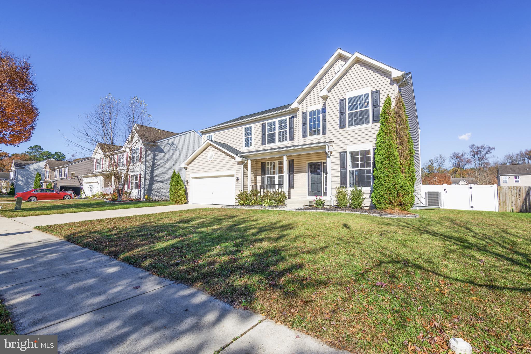 1208 Painted Fern Road Denton, MD 21629 - Photo 2 of 39 a front view of a house with a yard