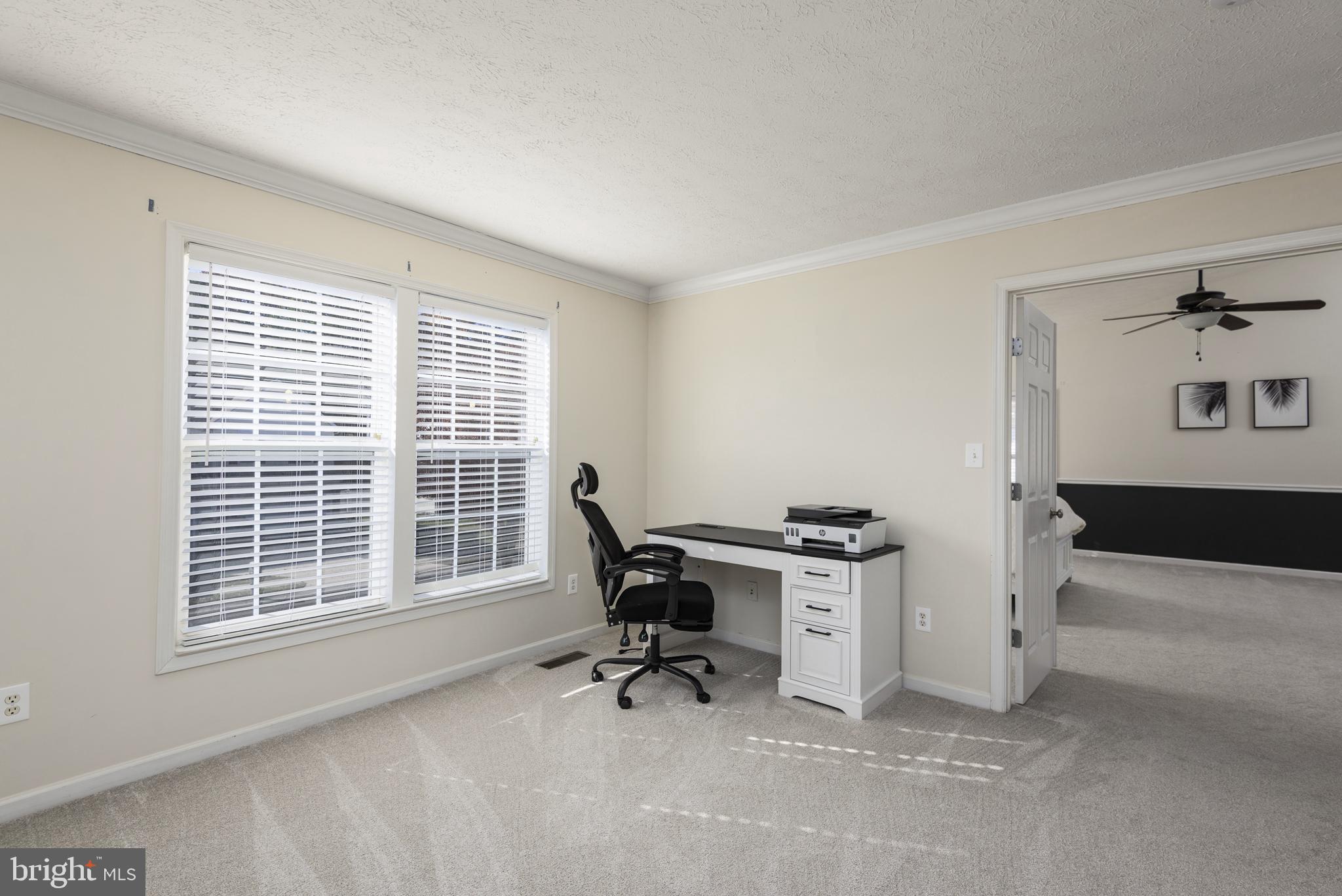 1208 Painted Fern Road Denton, MD 21629 - Photo 26 of 39 a view of a workspace with furniture and a window