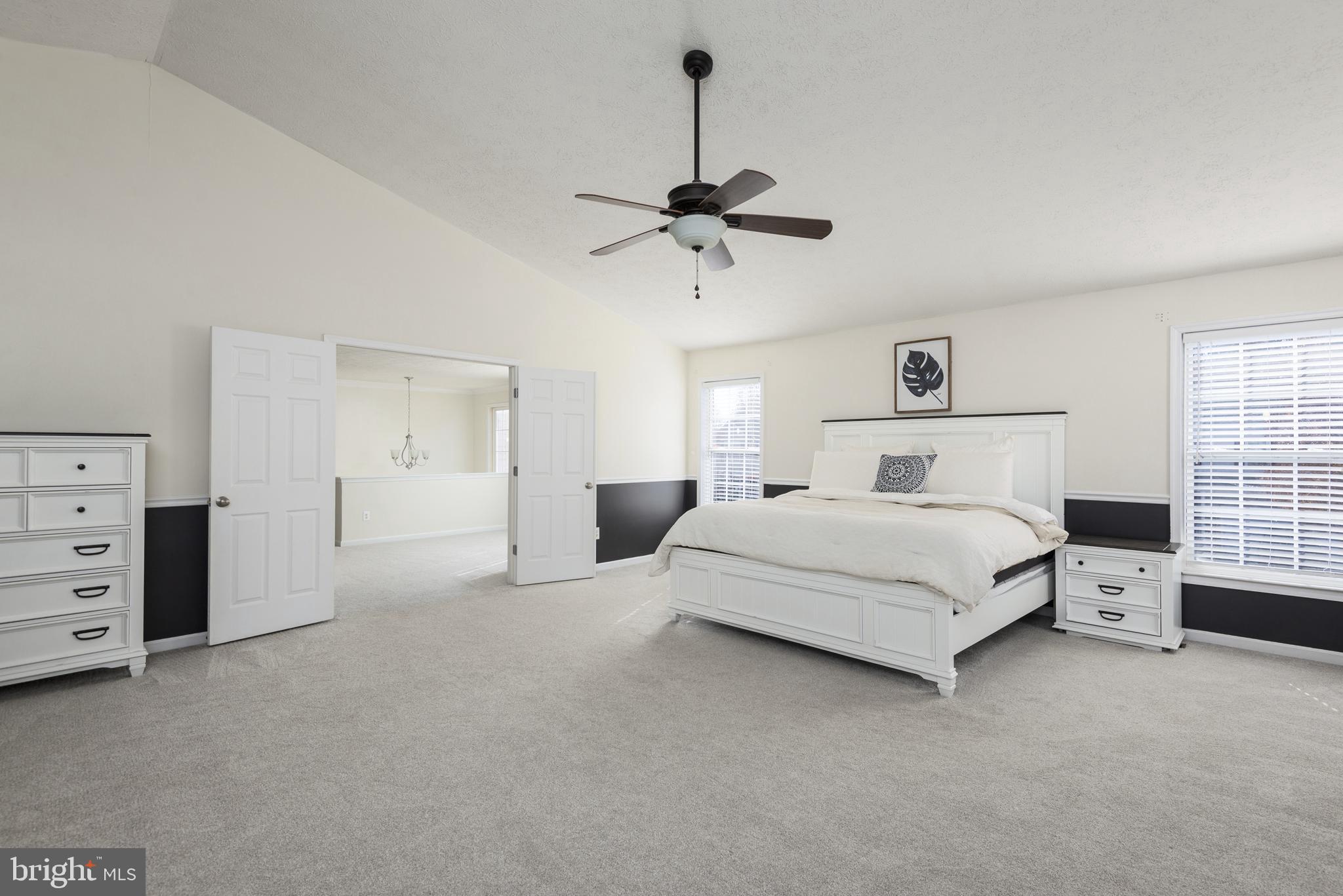 1208 Painted Fern Road Denton, MD 21629 - Photo 27 of 39 a spacious bedroom with a bed and a window