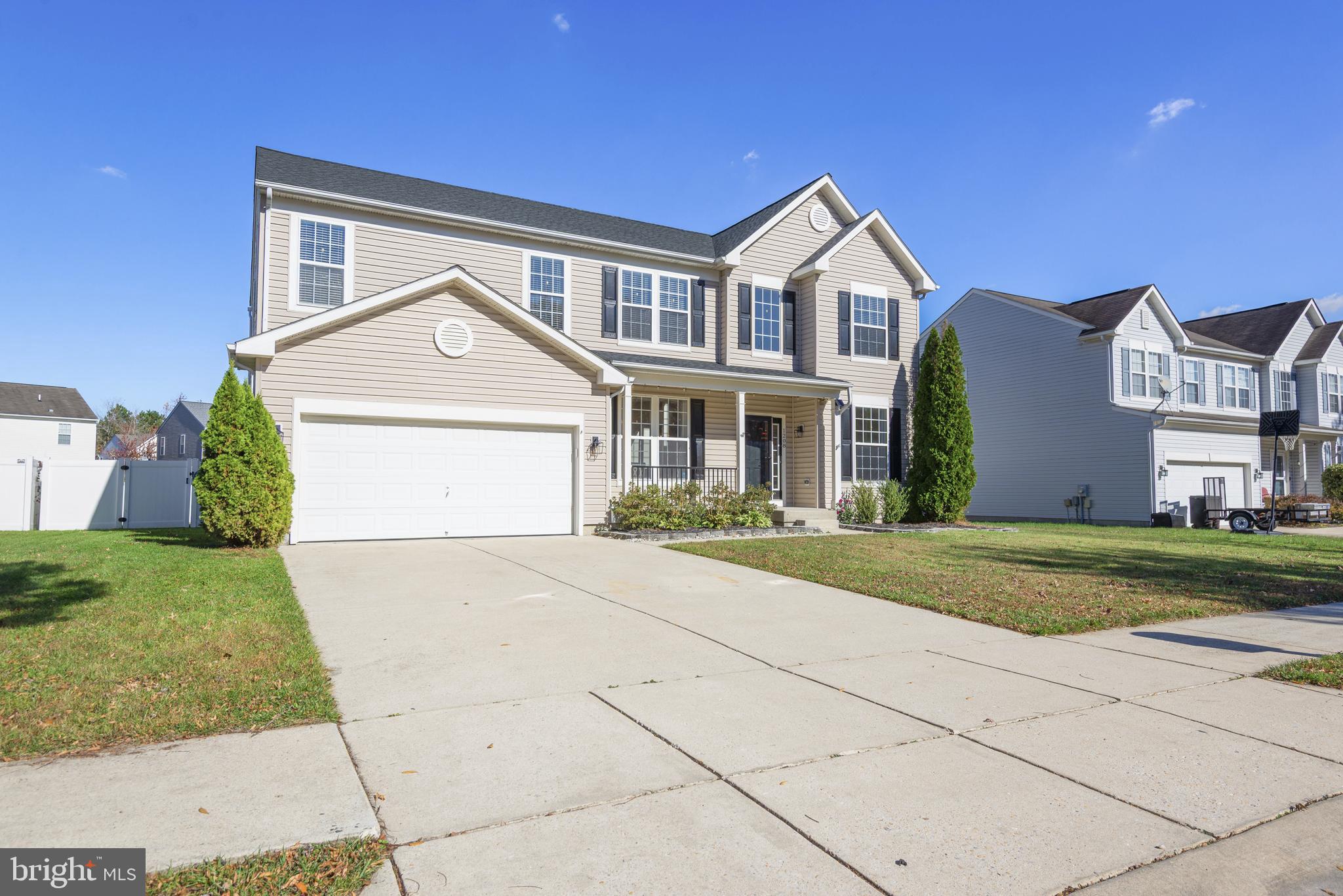 1208 Painted Fern Road Denton, MD 21629 - Photo 3 of 39 a front view of a house with a yard