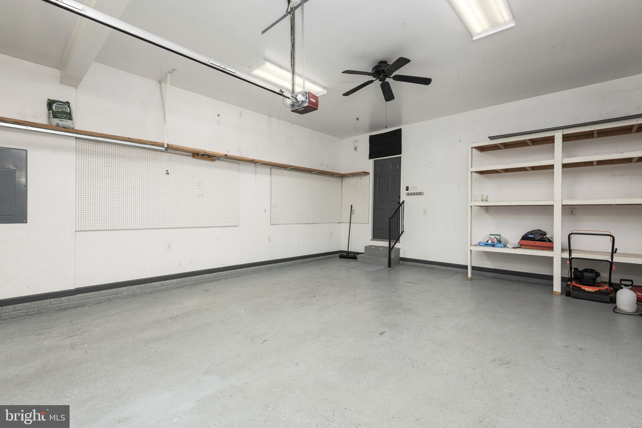 1208 Painted Fern Road Denton, MD 21629 - Photo 33 of 39 a view of a livingroom with cabinet and a ceiling fan