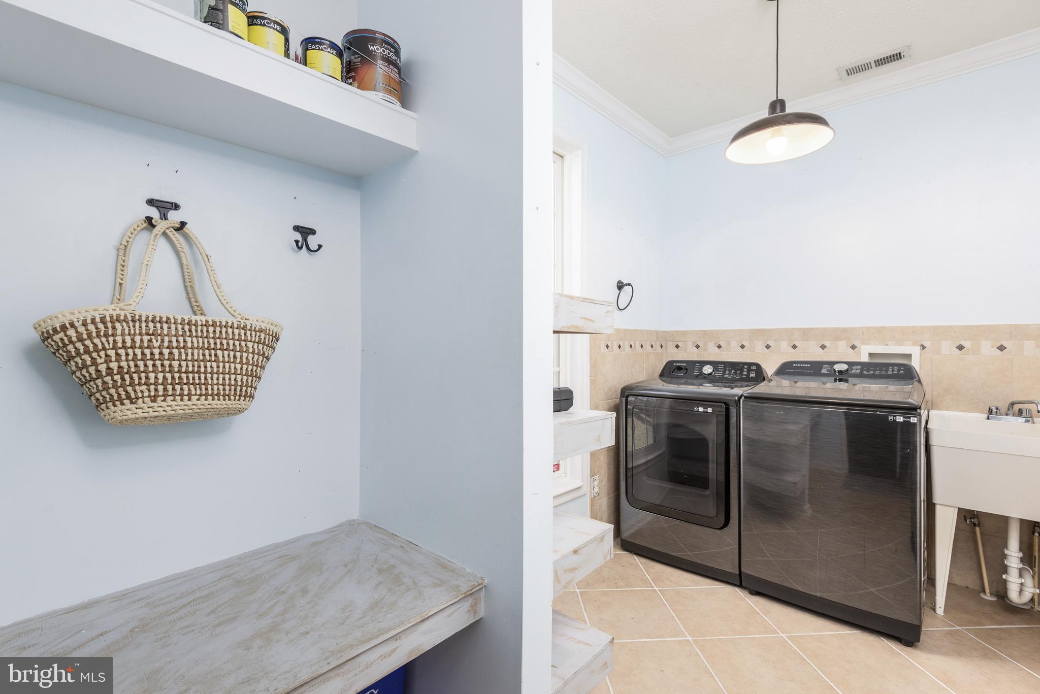 1208 Painted Fern Road Denton, MD 21629 - Photo 34 of 39 a kitchen with a stove and a sink