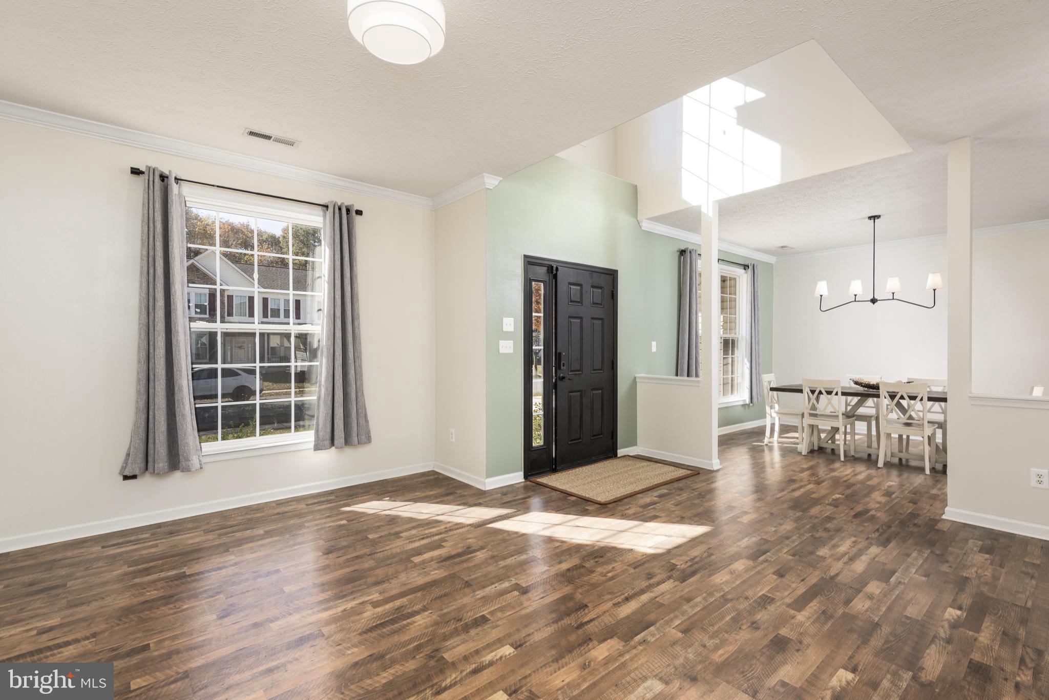 1208 Painted Fern Road Denton, MD 21629 - Photo 6 of 39 a view of a livingroom with furniture and a window