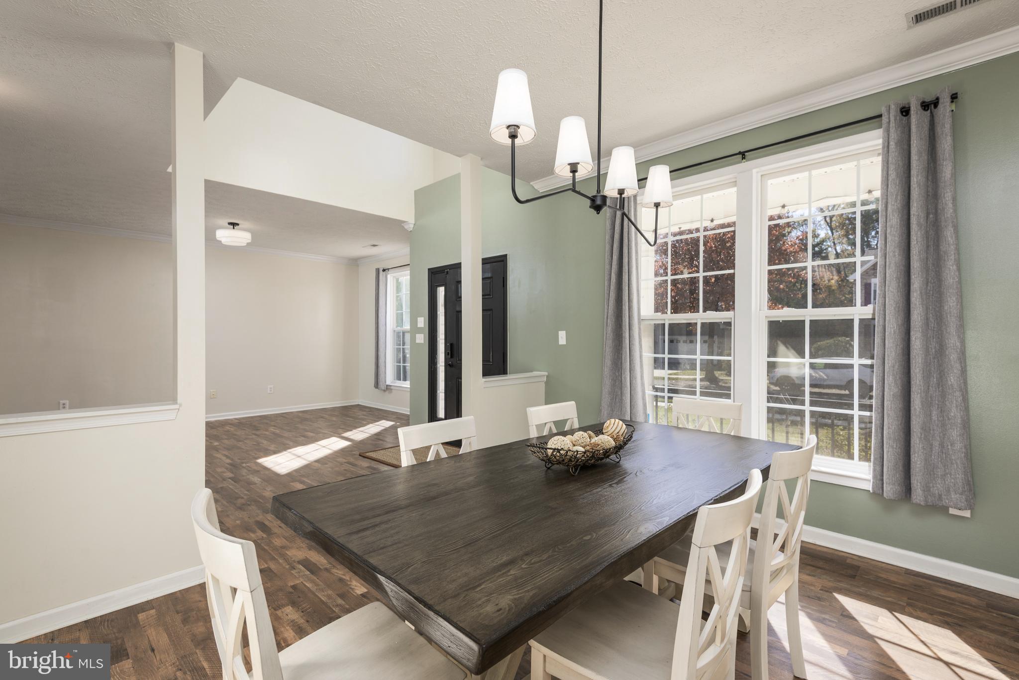 1208 Painted Fern Road Denton, MD 21629 - Photo 8 of 39 a view of a dining room with a table and chairs